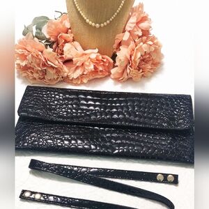 NWOT black patent clutch.